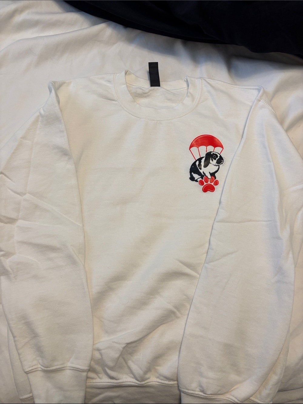 White Crewneck Sweatshirt with Red Paw & Parachute Graphic